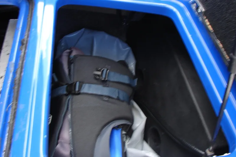 Slide: The Image of Storage compartment of 2017 Malibu Wakesetter 24 MXZ with life jacket inside. - 43