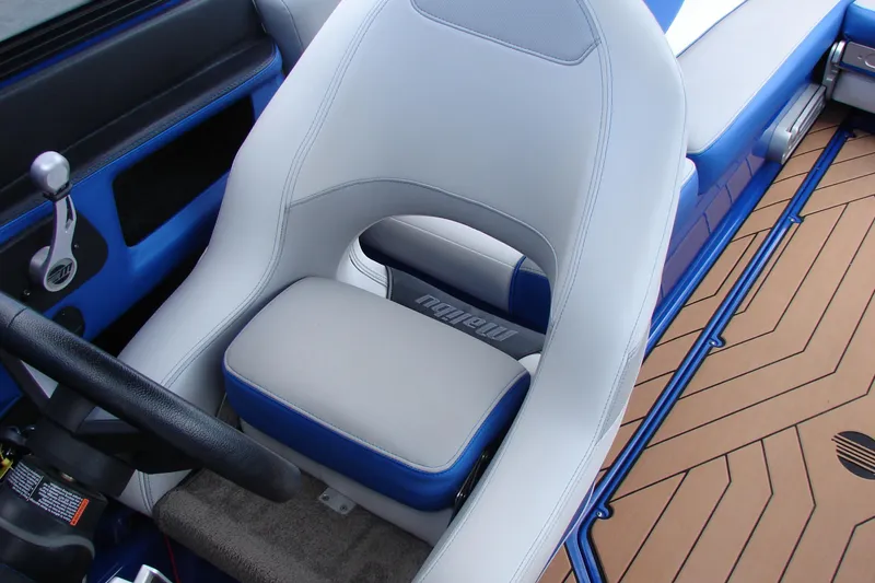 Slide: The Image of 2017 Malibu Wakesetter 24 MXZ interior with blue and white seating and steering wheel. - 45
