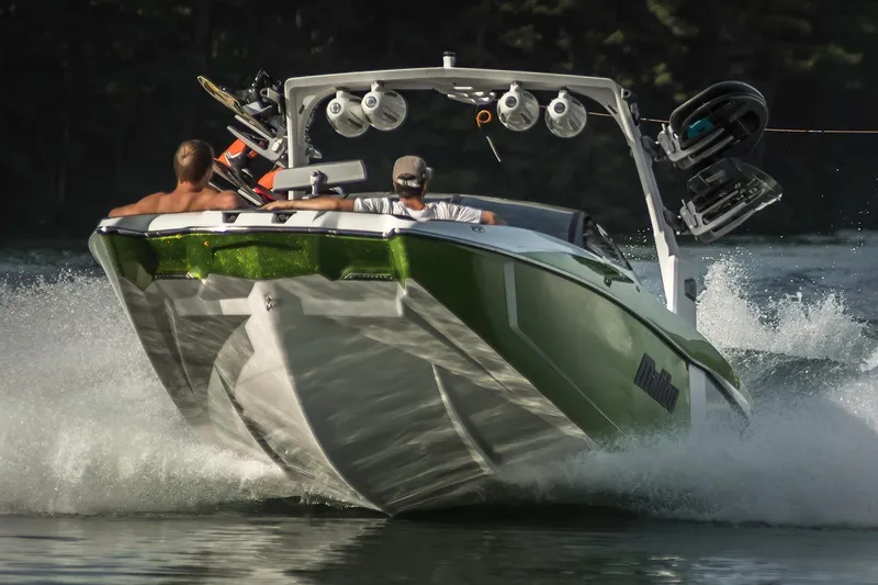 Slide: The Image of Manufacturer Provided Image: 2017 Malibu Wakesetter 24 MXZ speeding on water with passengers. - 51