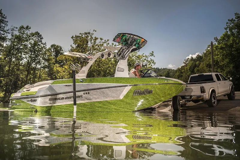 Slide: The Image of Manufacturer Provided Image: 2017 Malibu Wakesetter 24 MXZ boat being launched from a trailer into a lake. - 53