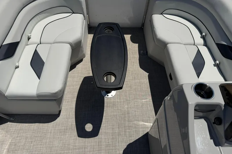Slide: The Image of 2022 SunCatcher Select 16C boat interior with gray seating and central table. - 14