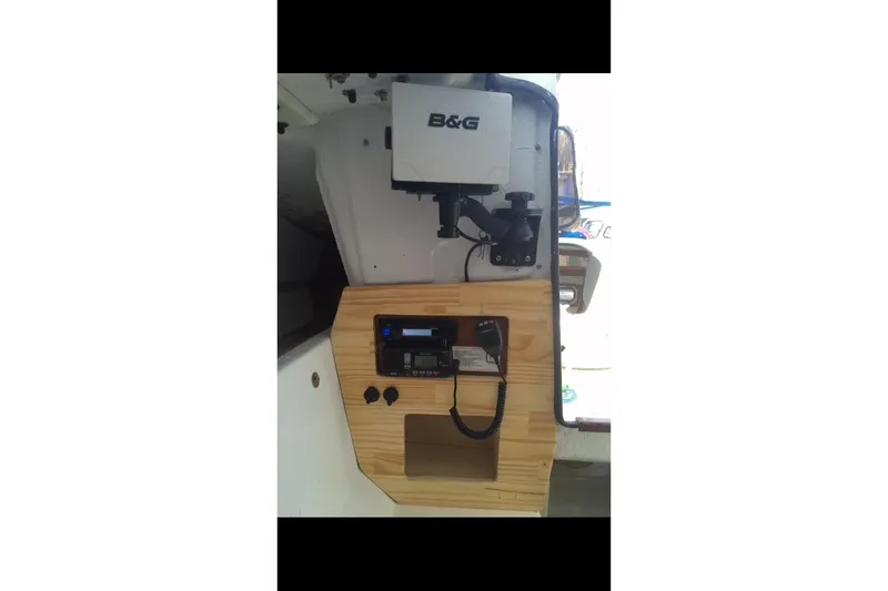 Slide: The Image of Interior of 1991 Corsair F 27 sailboat with navigation equipment and radio setup. - 4