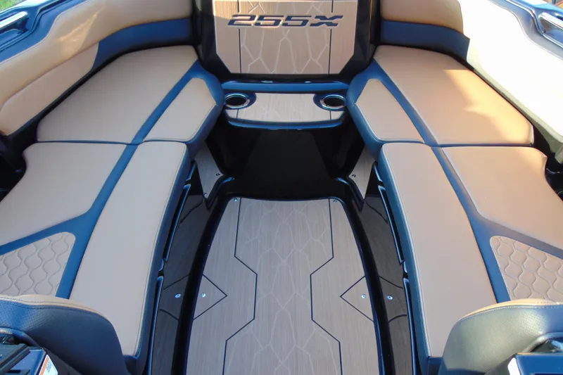 Slide: The Image of 2026 Yamaha Boats 255XD interior with tan seating and modern design. - 17