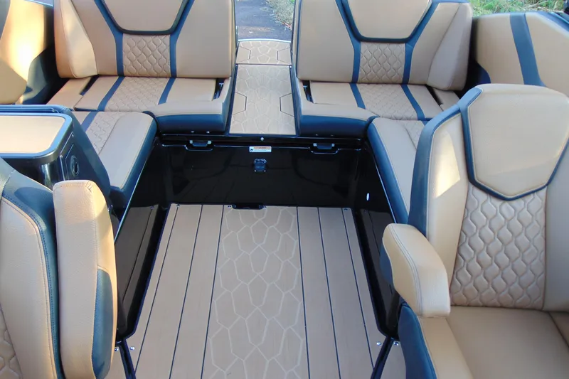 Slide: The Image of 2026 Yamaha Boats 255XD on trailer, sleek black design, parked outdoors. - 21