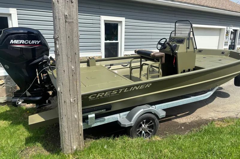 Slide: The Image of 2026 Crestliner 1870 Retriever FCC boat with Mercury engine on trailer. - 2