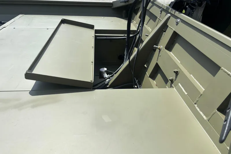 Slide: The Image of 2026 Crestliner 1870 Retriever FCC boat interior with open storage compartment. - 5