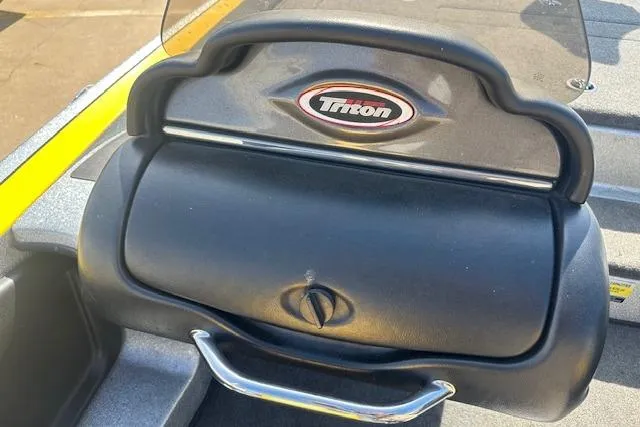 Slide: The Image of 2008 Triton 21X2 DC boat dashboard with logo and handle. - 10