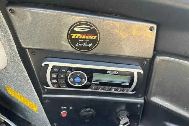 Slide: The Image of 2008 Triton 21X2 DC boat dashboard with Jensen stereo system. - 7