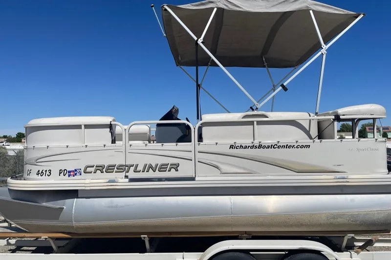 Slide: The Image of 2005 Crestliner Sport Classic 1685 pontoon boat with canopy on trailer. - 5