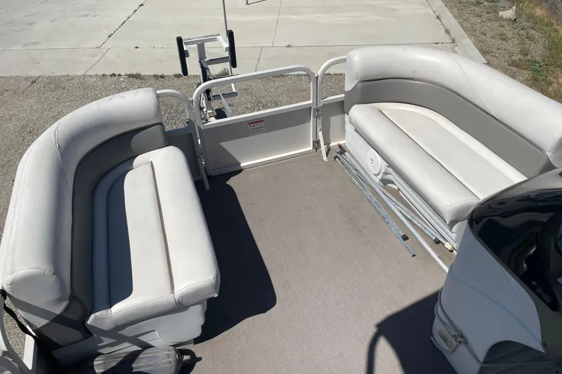 Slide: The Image of 2005 Crestliner Sport Classic 1685 pontoon boat interior with cushioned seating. - 8