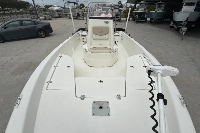 Slide: The Image of 2018 NauticStar 2140 Sport boat interior with seating and trolling motor. - 10