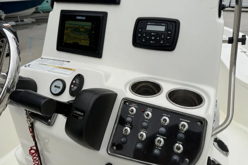 Slide: The Image of 2018 NauticStar 2140 Sport boat console with Yamaha controls and Simrad display. - 15