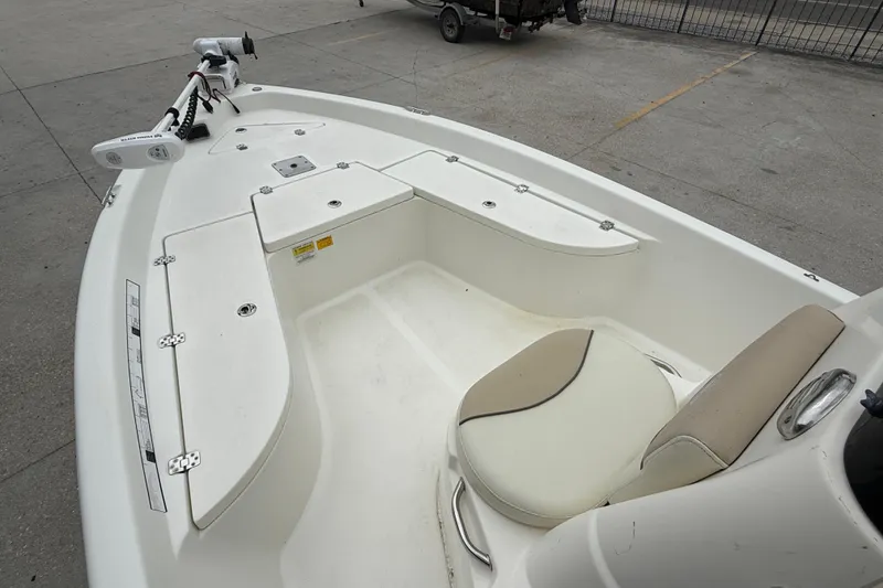 Slide: The Image of 2018 NauticStar 2140 Sport boat interior with seating and storage compartments. - 9