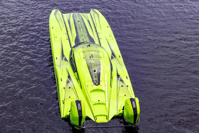 Slide: The Image of Bright green MTI 390XR powerboat on water, 2023 model, top view. - 12