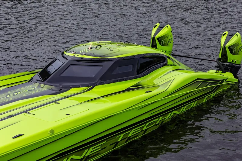 Slide: The Image of Bright green MTI 390XR speedboat on water, showcasing sleek design and modern technology. - 17