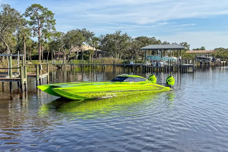 Slide: The Image of Interior of 2023 MTI 390XR with advanced dashboard, green lighting, and carbon fiber accents. - 4