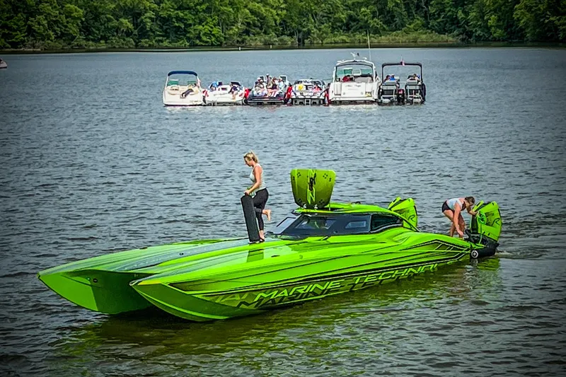 Slide: The Image of Interior of 2023 MTI 390XR with green accents, carbon fiber dashboard, and advanced touchscreen display. - 5