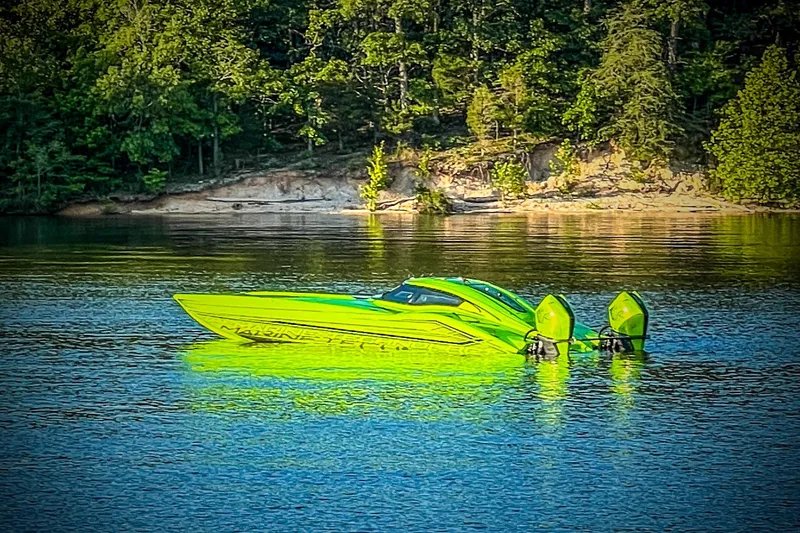 Slide: The Image of Interior of 2023 MTI 390XR with green accents, advanced navigation displays, and carbon fiber detailing. - 6