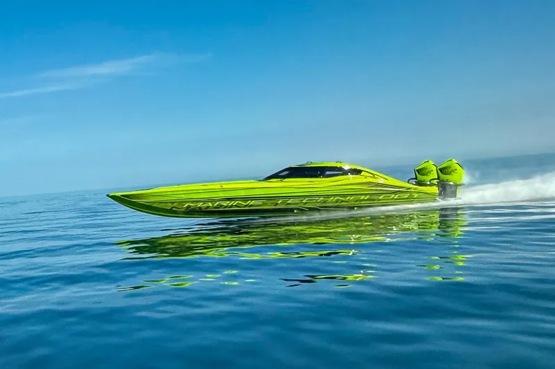 Slide: The Image of Interior of 2023 MTI 390XR with green-accented racing seats and harnesses. - 9