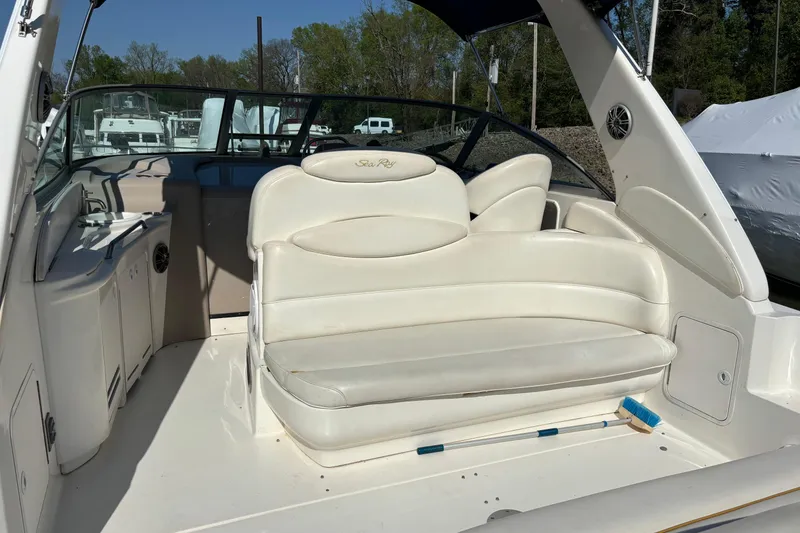 Slide: The Image of 2001 Sea Ray 340 Sundancer boat interior with white seating and cockpit view. - 4