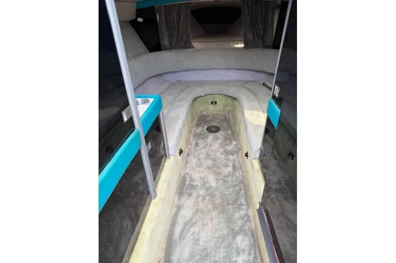 Slide: The Image of Interior of a 1989 Formula 292 SR-1 boat with seating and carpeted flooring. - 11