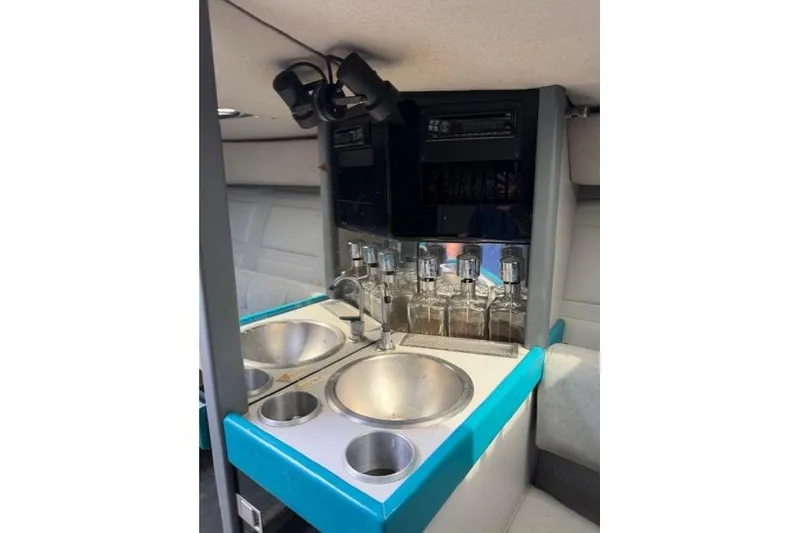 Slide: The Image of Interior of a 1989 Formula 292 SR-1 boat featuring a compact bar area. - 13