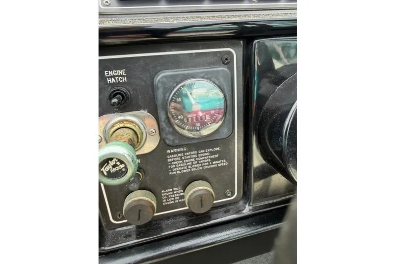 Slide: The Image of 1989 Formula 292 SR-1 dashboard with engine hatch controls and warning labels. - 15