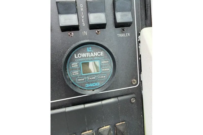 Slide: The Image of Lowrance sonar display on 1989 Formula 292 SR-1 dashboard with control switches. - 16