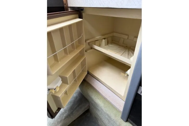 Slide: The Image of Open storage compartment in 1989 Formula 292 SR-1 boat interior. - 18