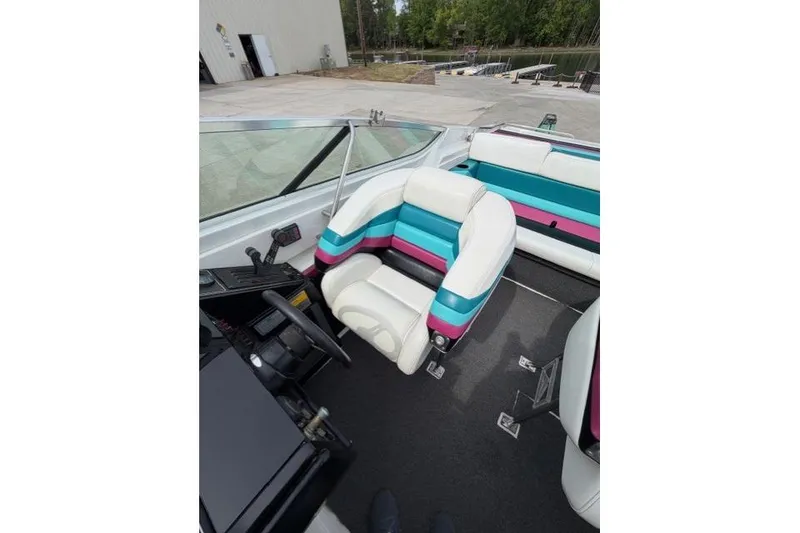 Slide: The Image of 1989 Formula 292 SR-1 boat interior with colorful striped seating. - 6