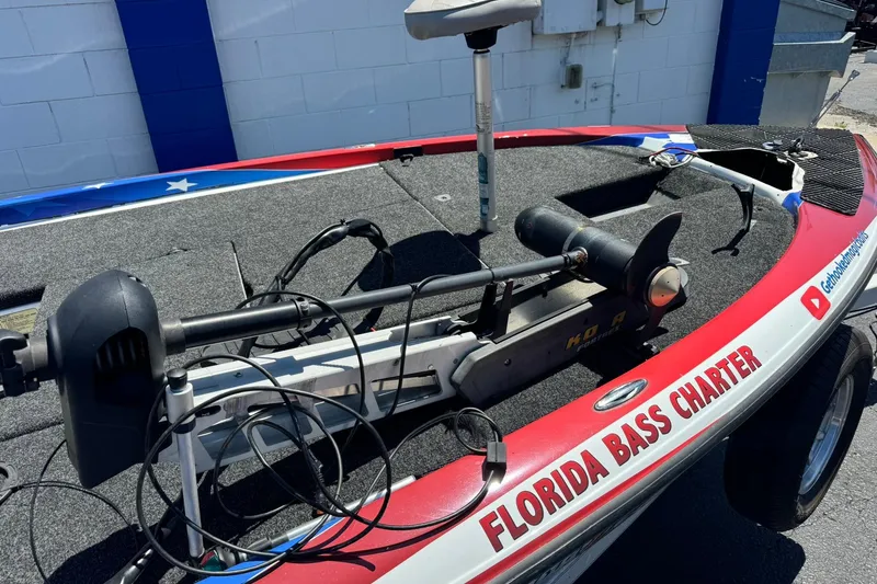 Slide: The Image of 2005 Skeeter ZX225 bass boat with trolling motor, labeled "Florida Bass Charter." - 5
