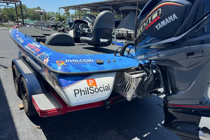 Slide: The Image of 2005 Skeeter ZX225 boat with Yamaha engine, featuring Philcoin and PhilSocial branding. - 8