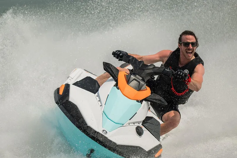 Slide: The Image of Manufacturer Provided Image: Man riding 2026 Yamaha WaveRunner JetBlaster LTD on water, creating splashes. - 10
