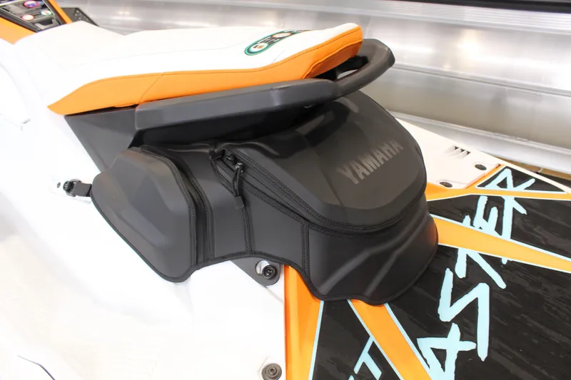 Slide: The Image of 2026 Yamaha WaveRunner JetBlaster LTD seat with storage compartment, featuring sleek design and vibrant colors. - 7