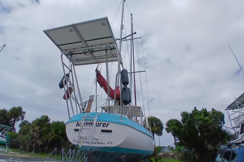 The Image of 1982 Morgan 416 sailboat on land, Cape Canaveral, Florida, under cloudy sky. - 1