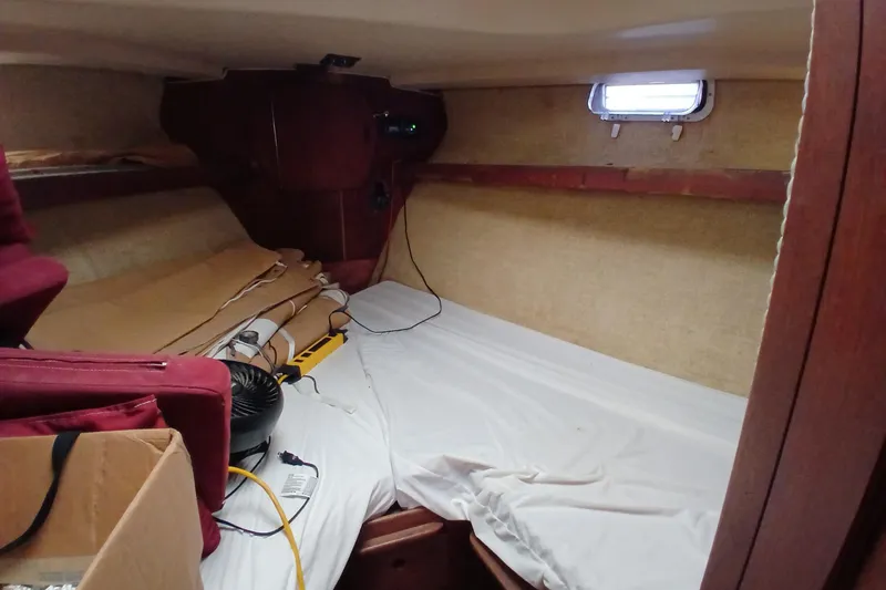 Slide: The Image of Interior cabin of a 1982 Morgan 416 sailboat, featuring a cozy sleeping area. - 26