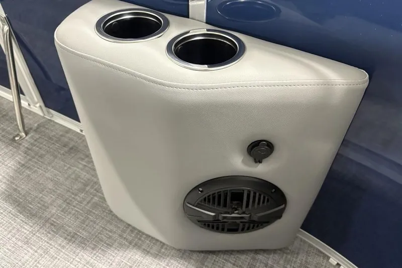 Slide: The Image of Cup holders and speaker on 2026 Sun Tracker SportFish 20 DLX boat interior. - 15