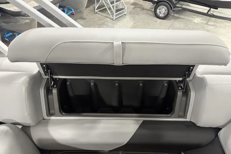 Slide: The Image of 2026 Sun Tracker SportFish 20 DLX boat seat storage compartment, open and empty. - 19