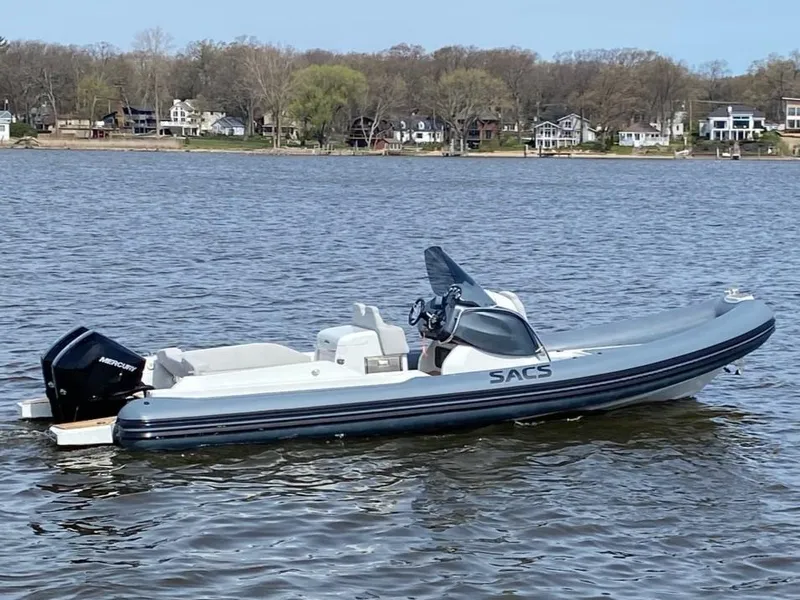 The Image of 2022 SACS Strider 900 inflatable boat on a calm lake. - 0