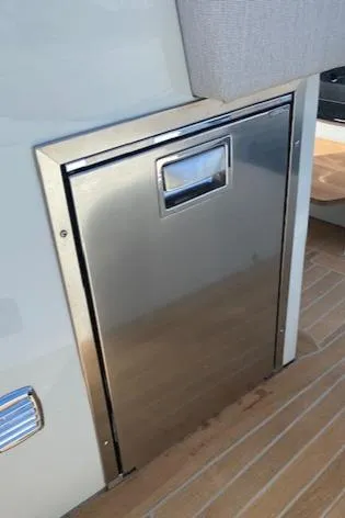 Slide: The Image of Stainless steel storage compartment on a 2022 SACS Strider 900 boat. - 13