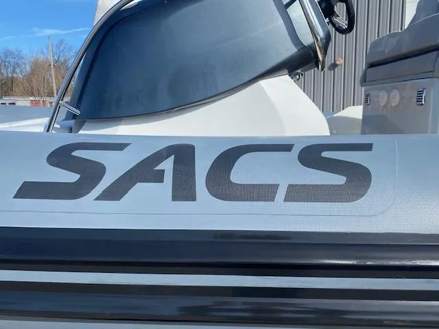 Slide: The Image of 2022 SACS Strider 900 boat with logo and windshield in view. - 4