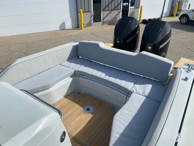 Slide: The Image of 2022 SACS Strider 900 boat with cushioned seating and twin Mercury outboard engines. - 6