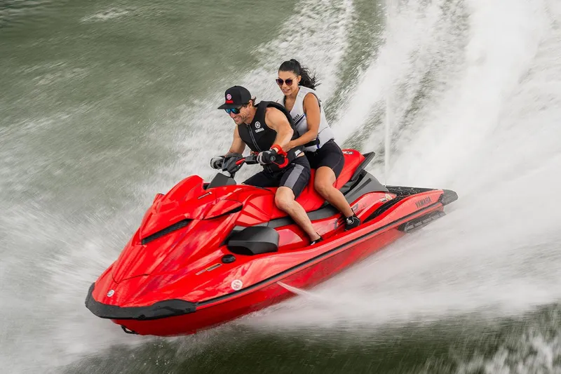 Slide: The Image of Manufacturer Provided Image: 2026 Yamaha WaveRunner GP SVHO jet ski with two riders speeding on water. - 11