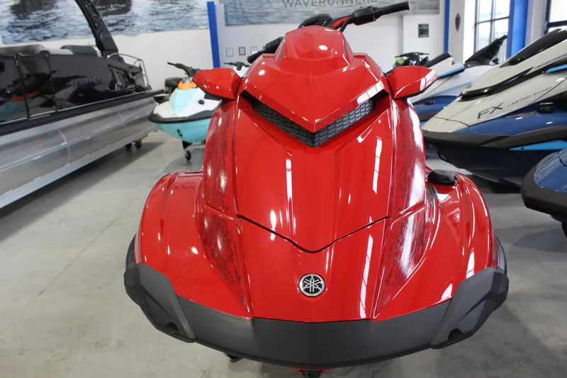 Slide: The Image of 2026 Yamaha WaveRunner GP SVHO in vibrant red, displayed in a showroom. - 2