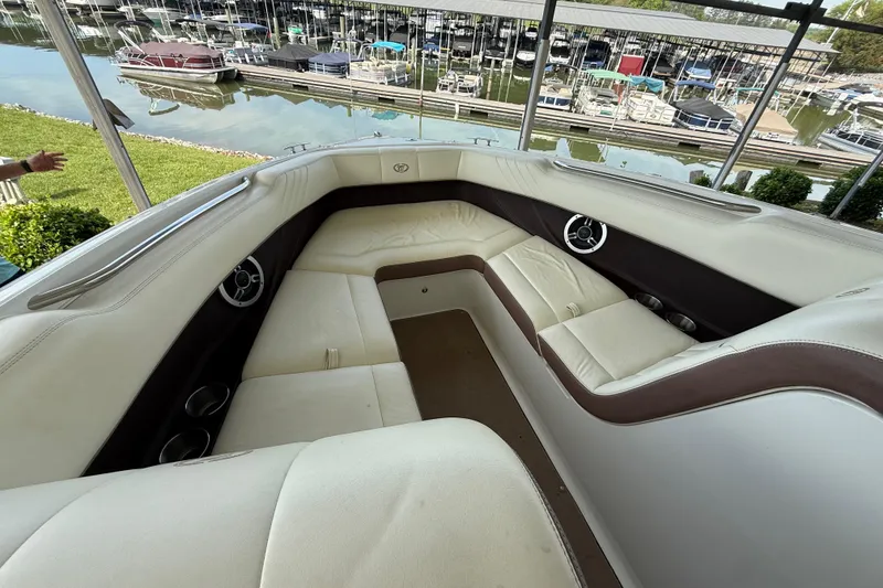 Slide: The Image of Luxurious interior of a 2011 Cobalt 232 boat docked at a marina. - 8