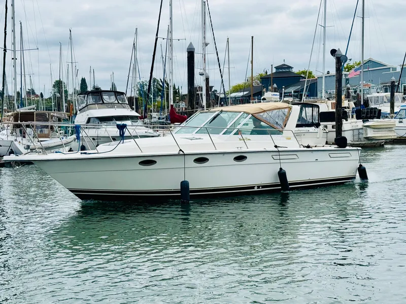 The Image of 1988 Tiara Yachts 3100 Open cruising on calm waters. - 0