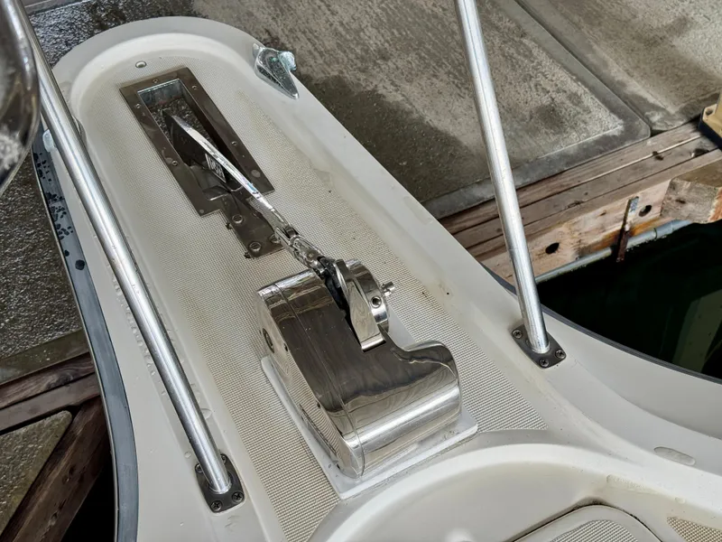 Slide: The Image of Anchor locker of a 1988 Tiara Yachts 3100 Open with ropes and chain inside. - 27