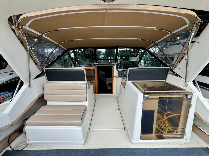 Slide: The Image of 1988 Tiara Yachts 3100 Open interior with helm, seating, and navigation equipment. - 8