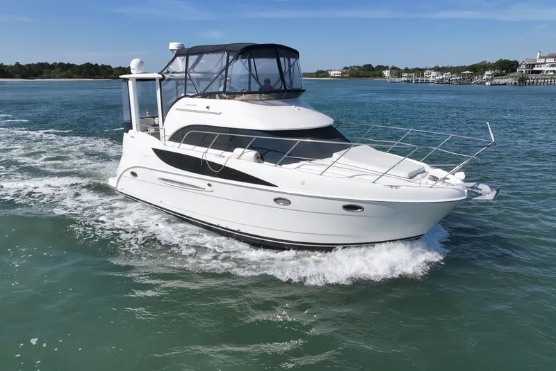 Slide: The Image of 2005 Meridian 368 Motoryacht cruising on clear blue water. - 10