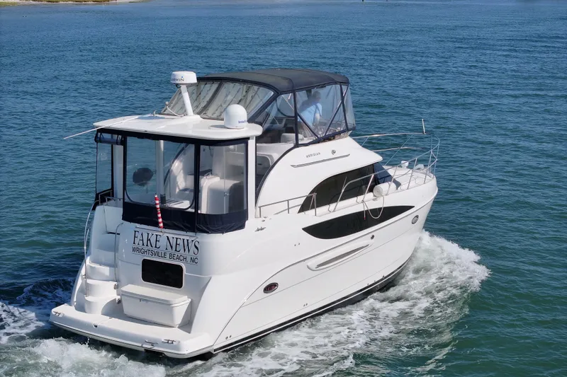 Slide: The Image of 2005 Meridian 368 Motoryacht cruising on blue waters near Wrightsville Beach. - 13